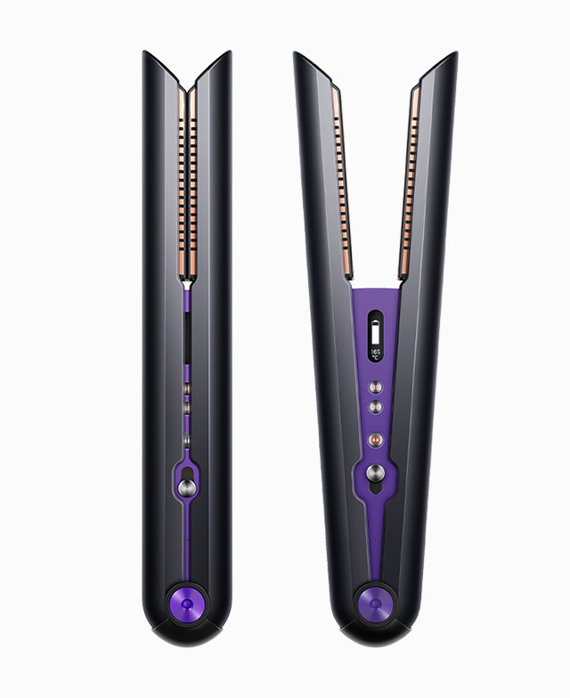 Woman drying her hair with the Dyson supersonic hair dryer