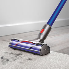 V8 Absolute cord-free vacuu cleaning floors with soft roller cleaner head